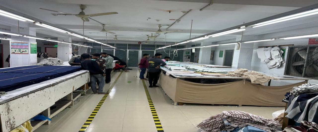 Cutting section marker layout on navy fabric