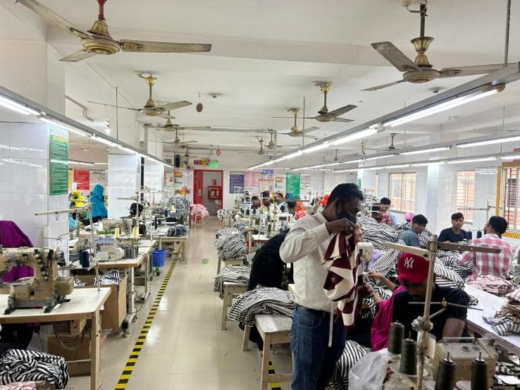 Sewing line operator measuring fabric