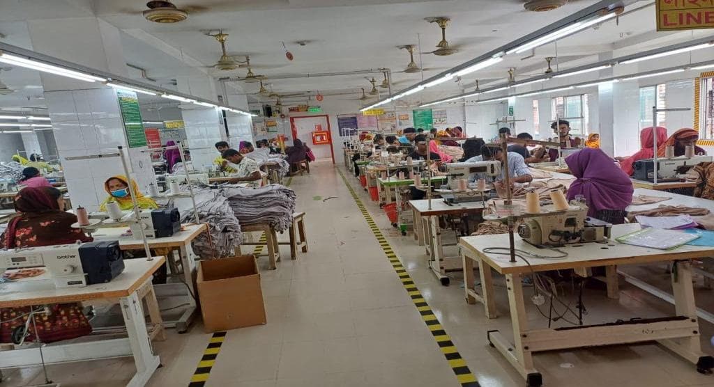 Wide view of the sewing production floor with multiple lines