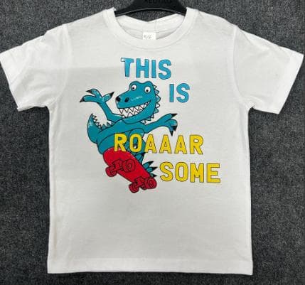 Kids white knit t-shirt with a skateboarding dinosaur print
